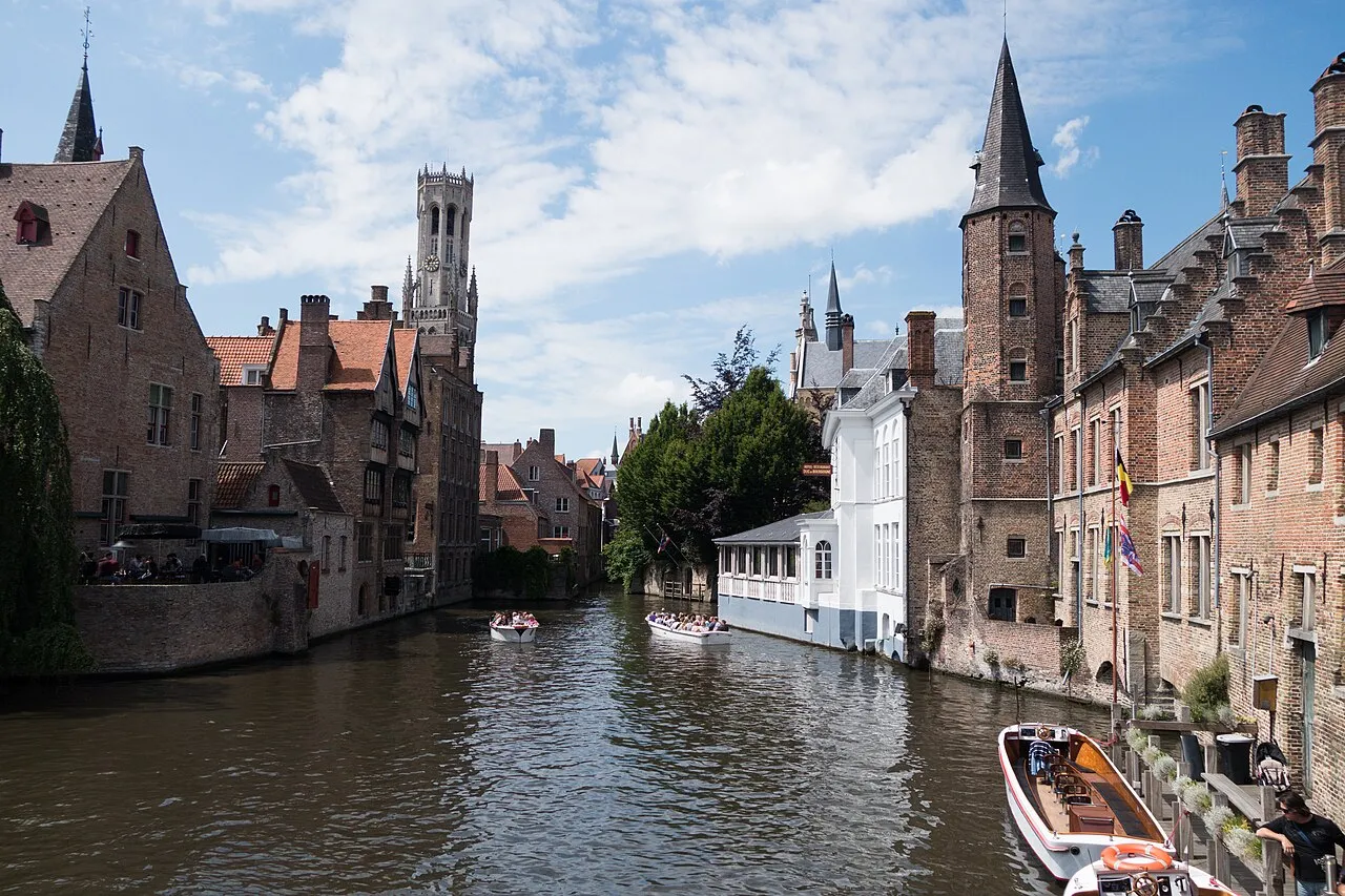 A Bruges canal, brick houses and the Belfry